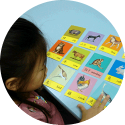 students practicing with word cards